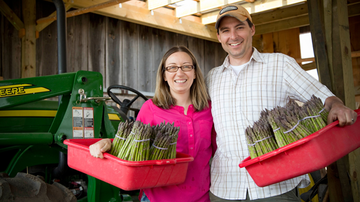 couple holding asparagus