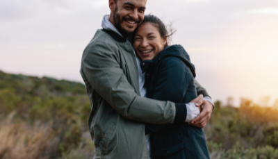 a couple hugging and smiling