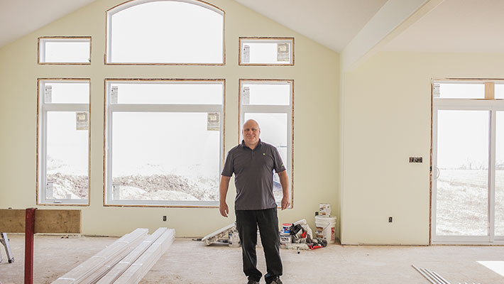 man standing in home