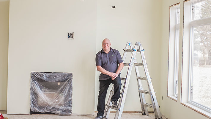 man standing in home