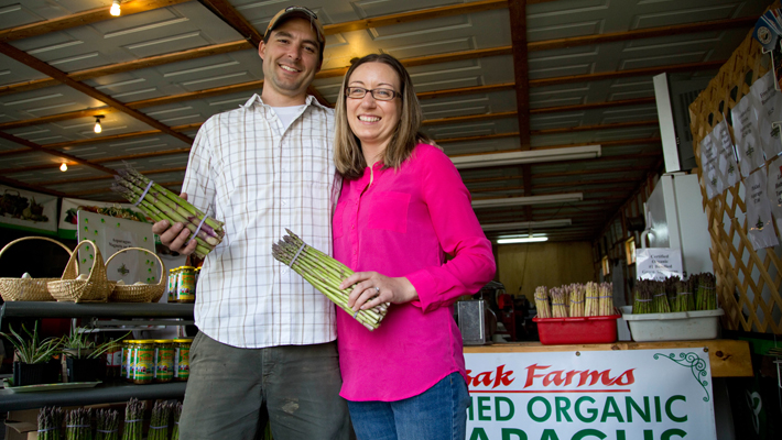 couple holding asparagus