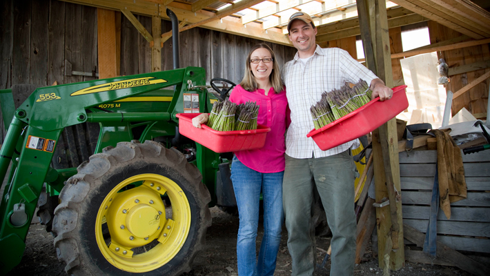 couple holding asparagus