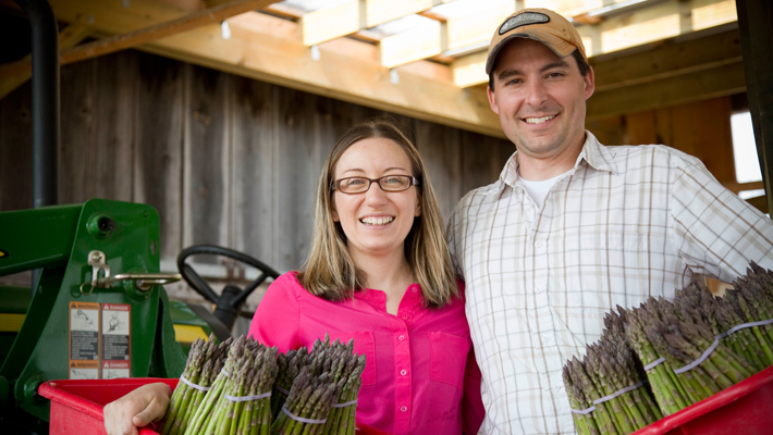 couple holding asparagus