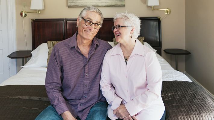 couple sitting on bed